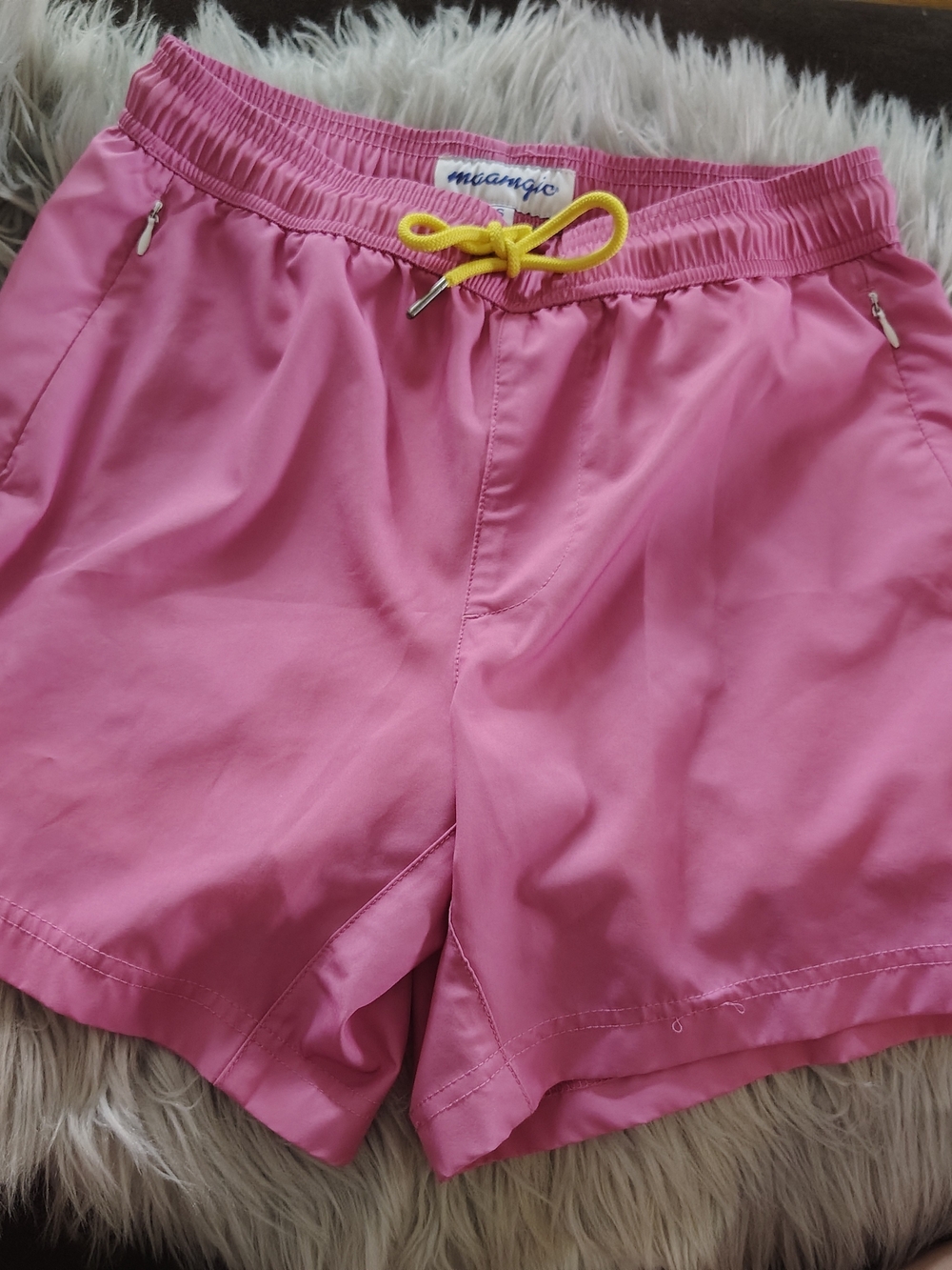The Maamgic Swim Trunks for men in size small feature a vibrant pink and yellow